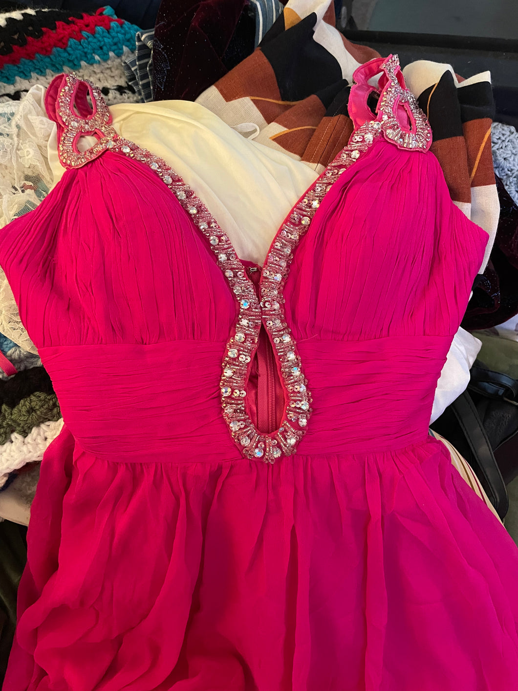 It’s a JOVANI Hot Pink Barbie Dress